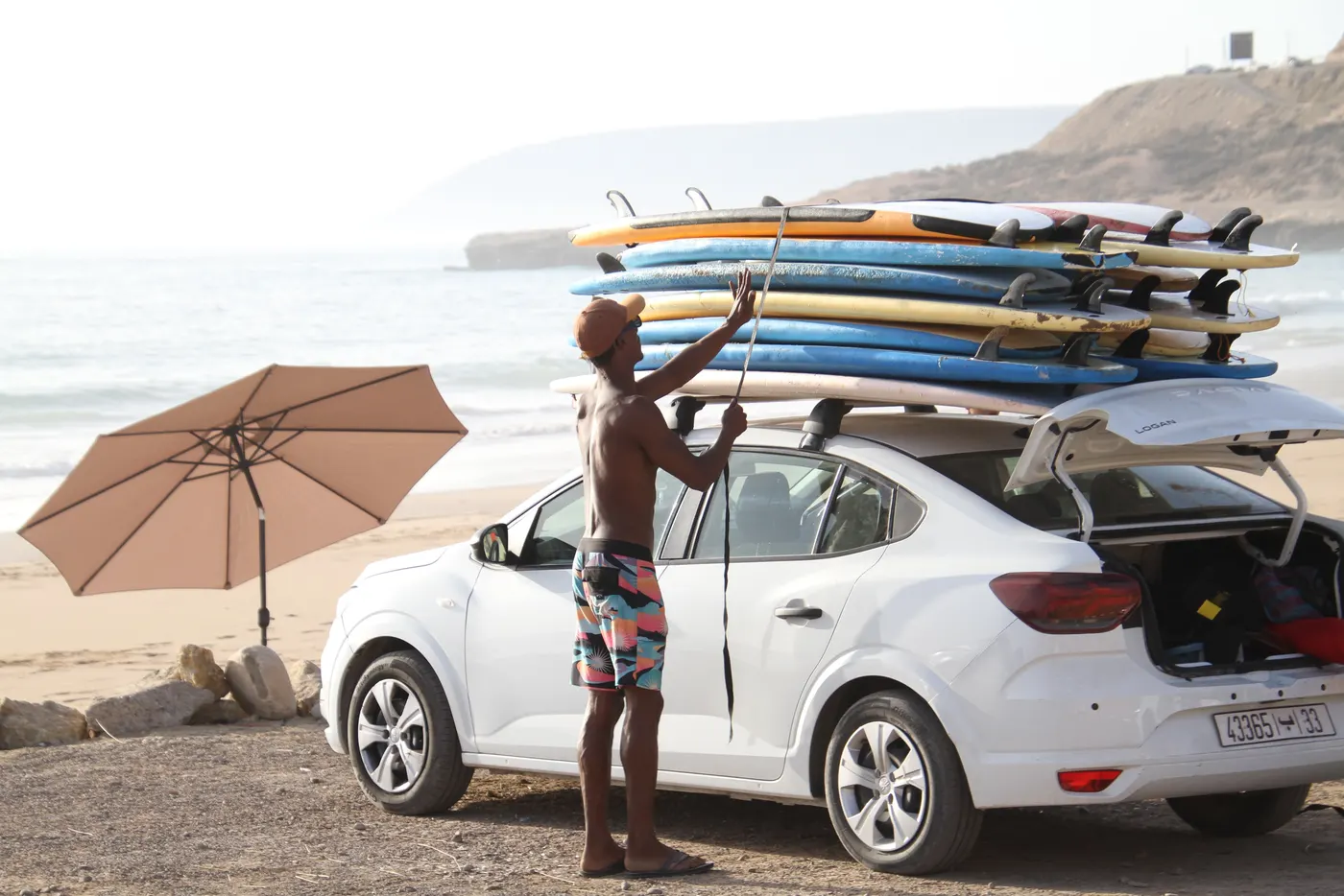 Chafik loading the boards on the car roof
