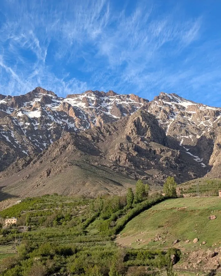 Breathtaking landscape of the Atlas Mountains with clear blue skies in Tachdirt, Morocco.