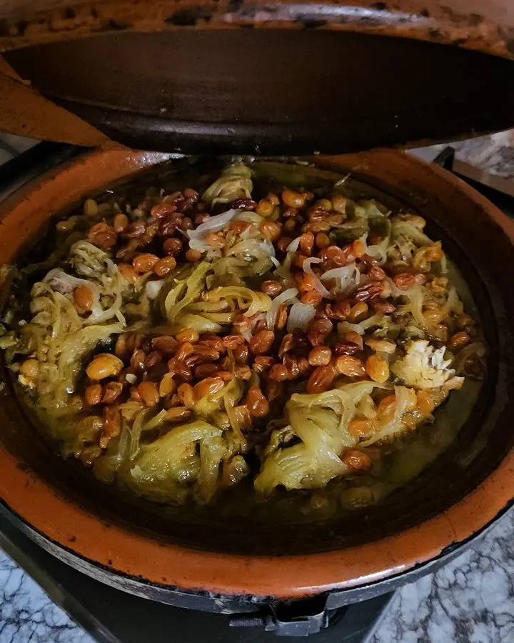 A flavorful Moroccan tagine dish with chickpeas and vegetables, perfect for ethnic cuisine lovers.