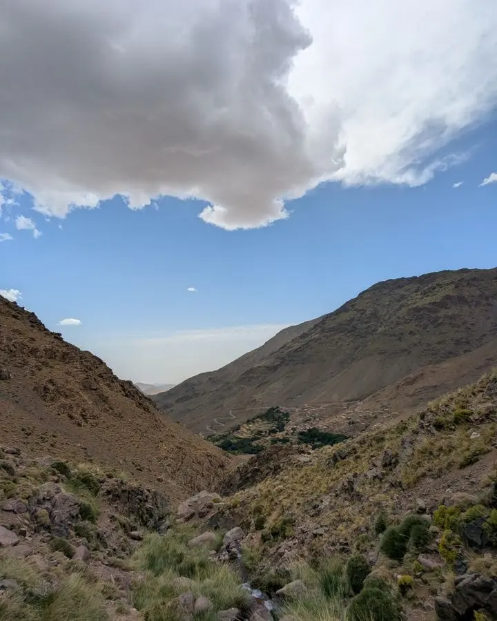 Scenic view of Tachdirt's rugged mountains under a dramatic sky in Souss-Massa, Morocco.