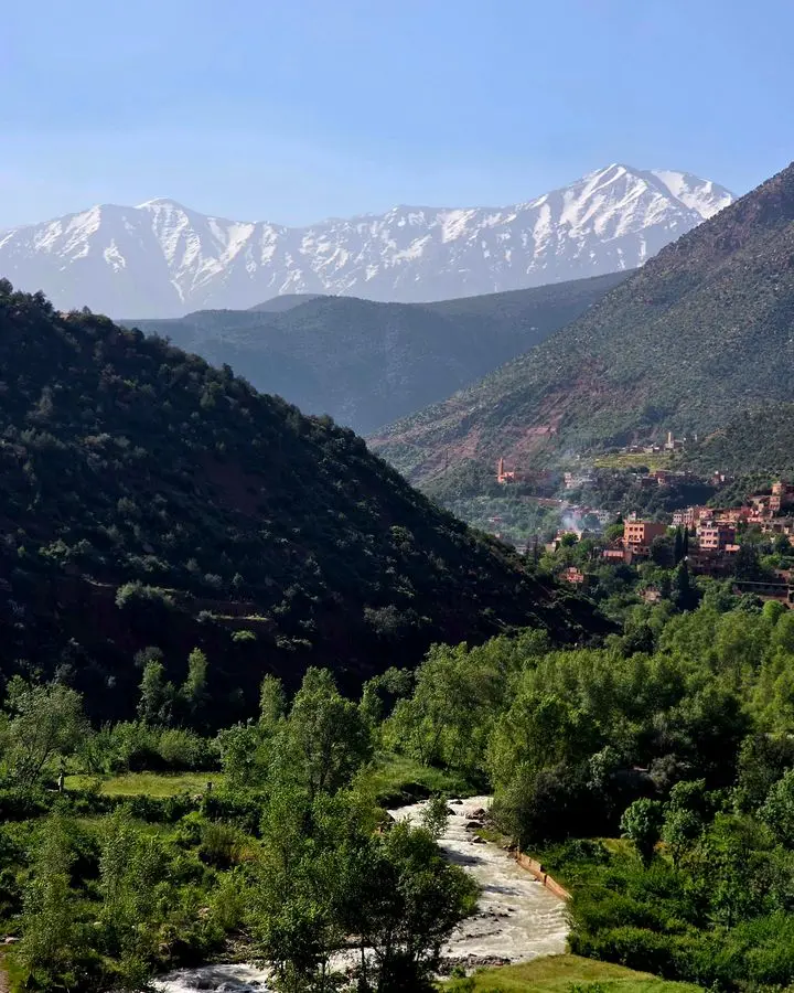 Beautiful landscape showcasing Ourika Valley with the snow-capped Atlas Mountains in Morocco.
