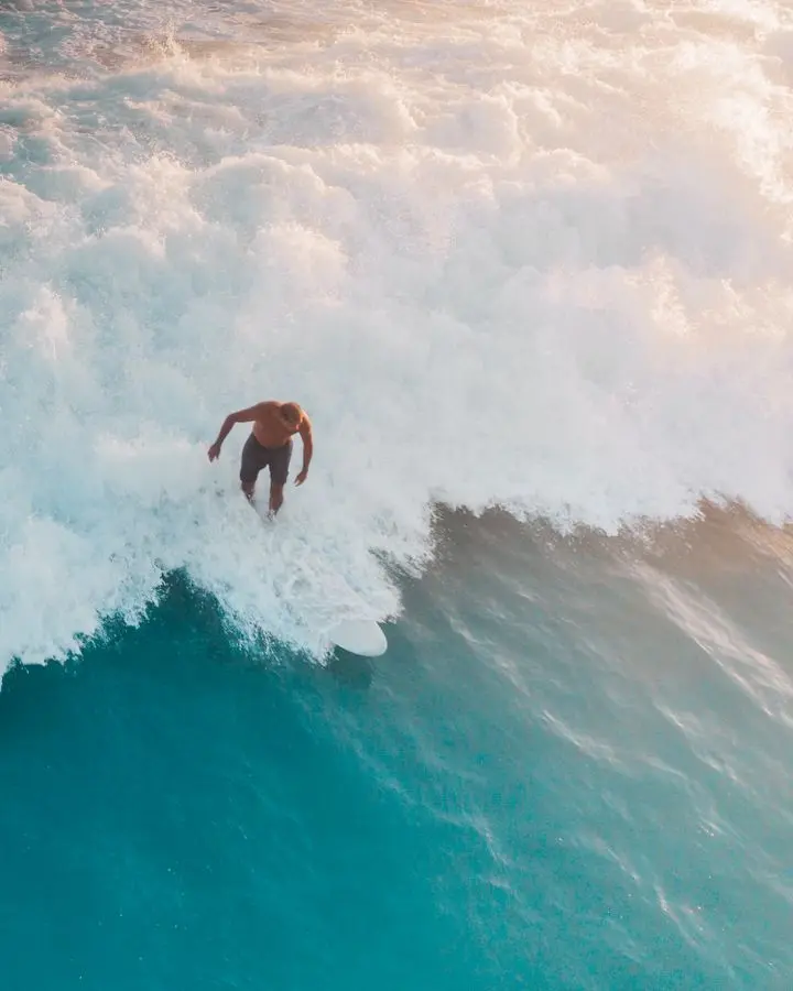 A thrilling surfing experience capturing a surfer riding the perfect ocean wave.