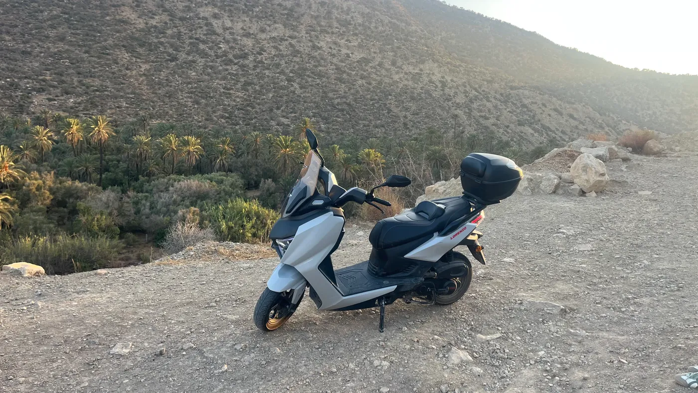 Electric scooter at a viewpoint over the argan valley