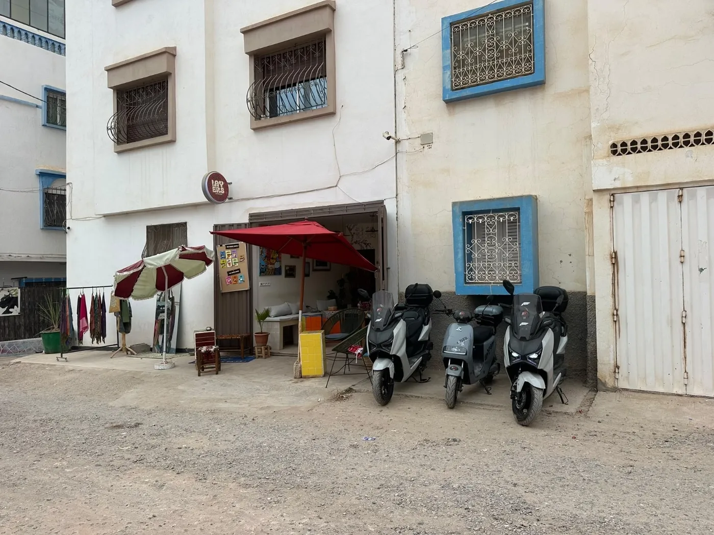 Electric scooters lined up outside the rental shop