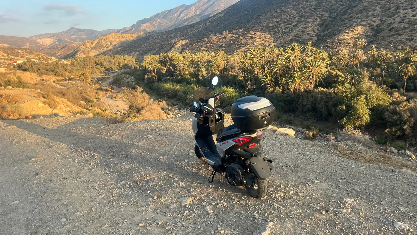 Electric scooter on a valley track at golden hour